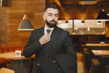 Stylish businessman in a black suit