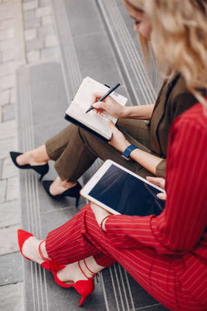Two businesswomen working in a cityの写真素材