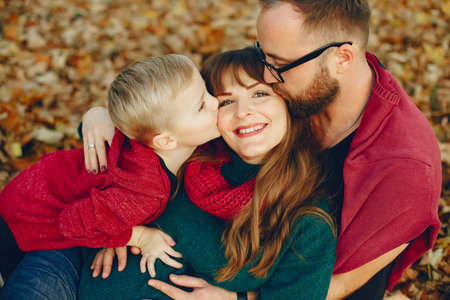 Family with little son in a autumn park