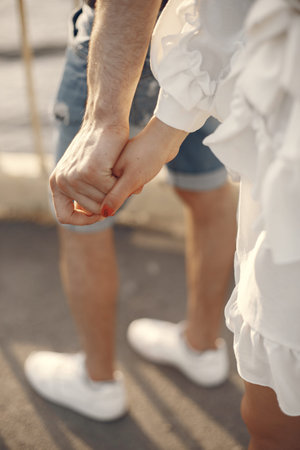 Beautiful couple spend time in a summer park