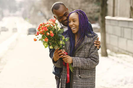 African american couple in a winter cityの写真素材