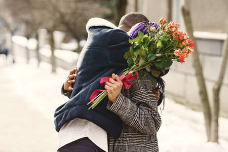African american couple in a winter cityの写真素材