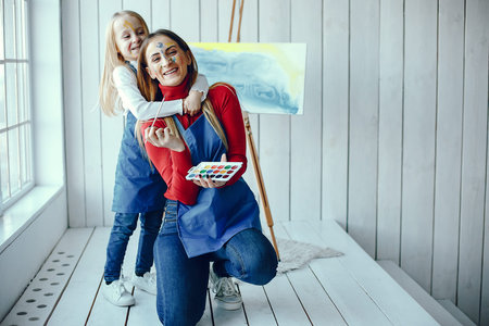 Mom and daughter are drawing