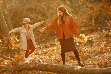 Cute and stylish family in a autumn parkの写真素材