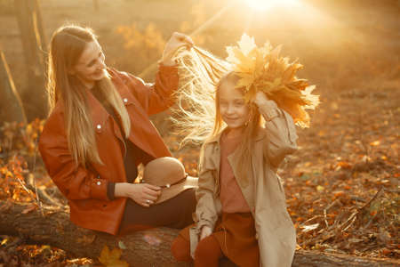 Cute and stylish family in a autumn parkの写真素材