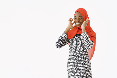 Nigerian woman in traditional clothes posing in studio