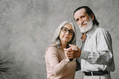 The happy elderly woman and a man dancingの写真素材