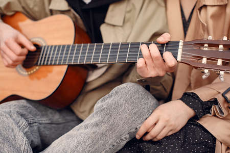 Beautiful couple spend time in a autumn fieldの写真素材