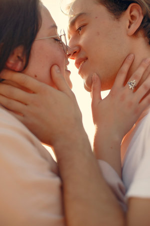 Beautiful couple spend time on a summer forest