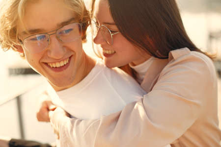 Beautiful couple spend time on a summer parkの写真素材