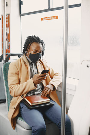 Young African businessman in a bus