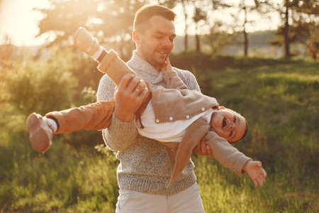 Cute family playing in a summer fieldの写真素材