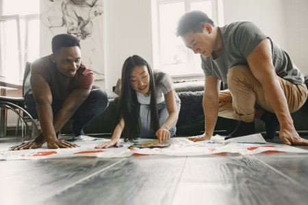 Three friends playing twister in the living room