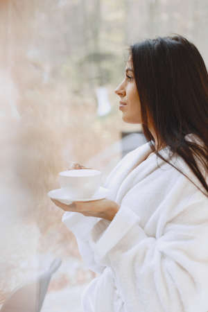 Picture of beautiful woman in white bathrobeの写真素材