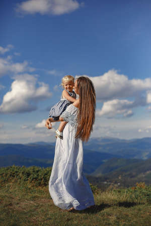 Mother and daughter and mountain viewsの写真素材