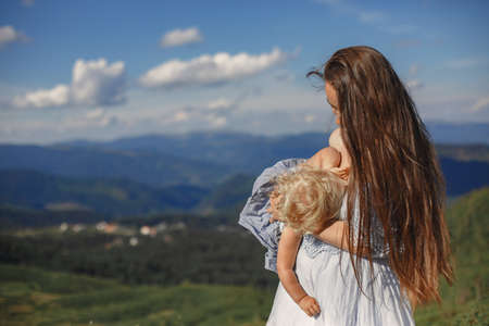 Mother and daughter and mountain viewsの写真素材