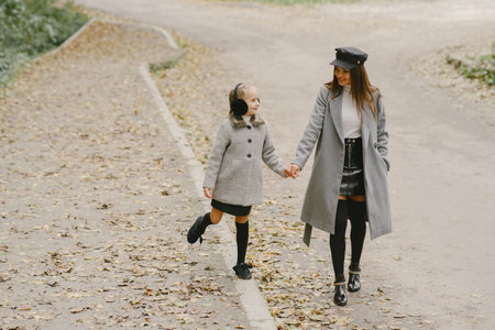 Cute and stylish family in a autumn parkの写真素材