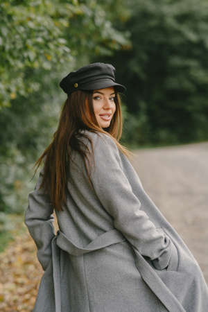 Elegant woman in a autumn parkの写真素材