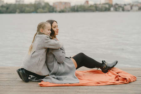 Cute and stylish family in a autumn parkの写真素材