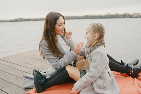 Cute and stylish family in a autumn parkの写真素材