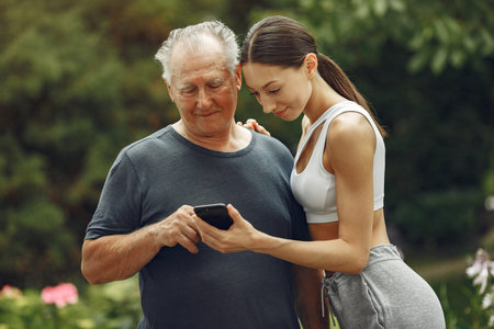 Portrait of happy handsome older man using smartphone