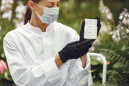 Young attractive woman in a white doctors coatの写真素材