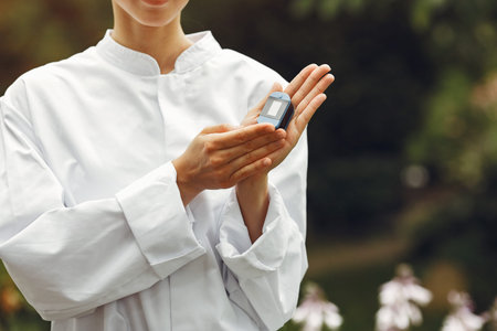 Young attractive woman in a white doctors coat