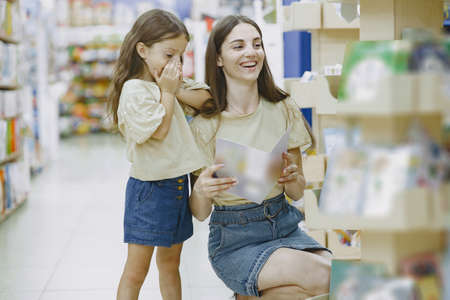 Family choosing school stationery in the supermarketの写真素材