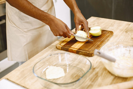 Man hands chopping food ingredientsの写真素材