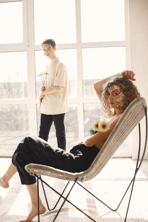 Portrait of a beautiful young woman with flowers. Tenderness and aroma.の写真素材