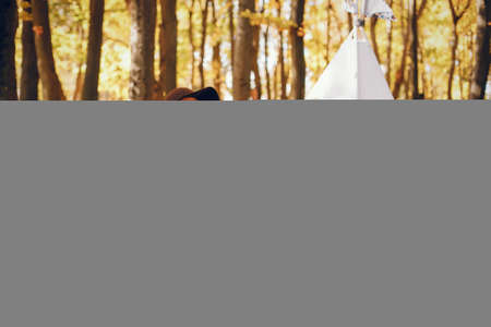 Beautiful and stylish family in a parkの写真素材