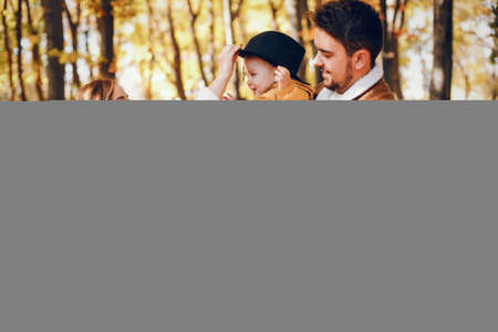 Beautiful and stylish family in a parkの写真素材