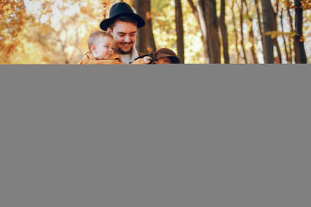 Beautiful and stylish family in a parkの写真素材