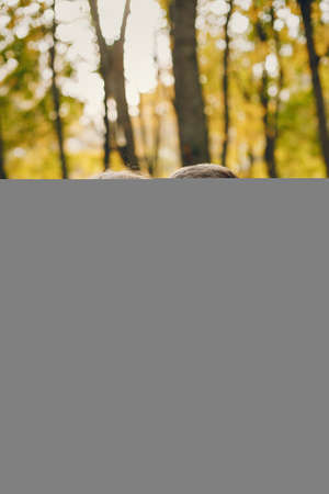 Beautiful couple spend time in a autumn parkの写真素材