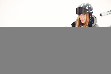 Girl snowboarding in the mountains with the snowboardの写真素材