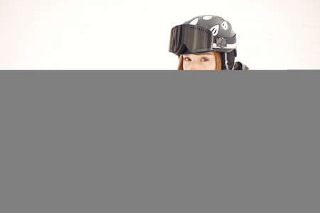 Girl snowboarding in the mountains with the snowboardの写真素材