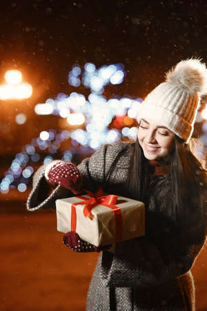 Young woman in night winter cityの写真素材