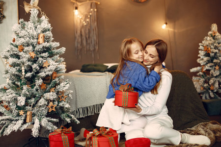 Mother with little daughter at home