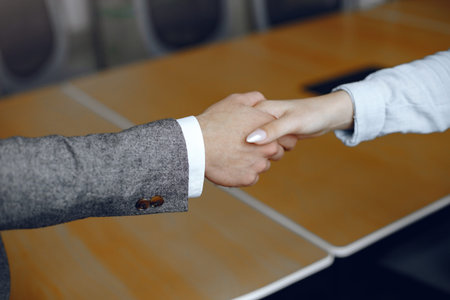 Handshake isolated on business background