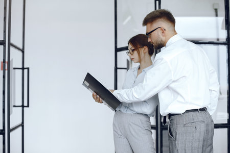 Colleagues discuss documents