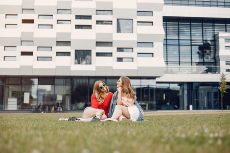 Elegant and stylish girl in a spring parkの写真素材