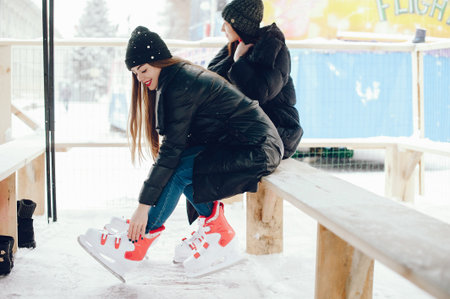 Cute and beautiful girls in a white sweater in a winter city