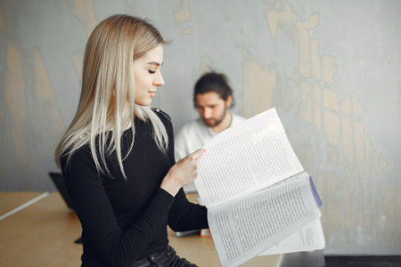 Stylish businessman with woman working at the officeの写真素材