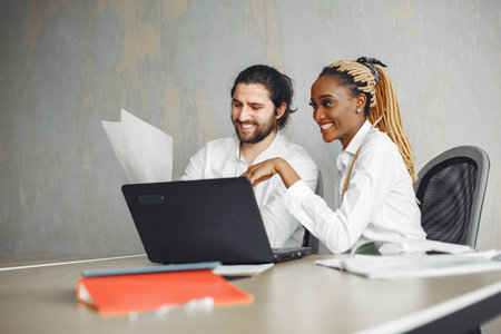 Mixed businesspeople working at the office