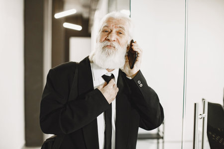 Handsome pensive mature businessman in formal suit
