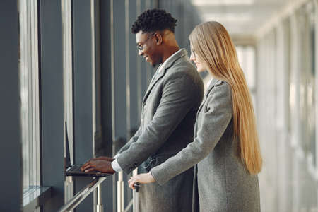 Businessman with his partner working in a officeの写真素材