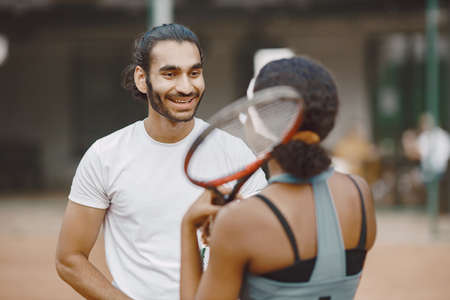 Two tennis players talking on a tennis court before the matchの写真素材