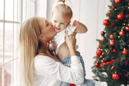 Mother and little daughter spend time together in a New Years setting.の写真素材