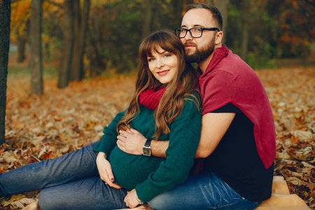 Elegant couple spend time in a autumn parkの写真素材