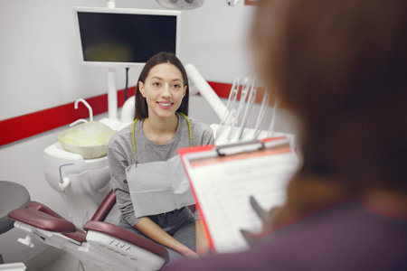Beautiful girl sitting in the dentists office